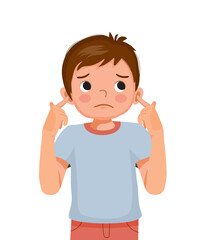 Fototapeta premium Cute little boy not listening plugging and covering his ears with fingers from noisy loud sound showing annoyed facial expression