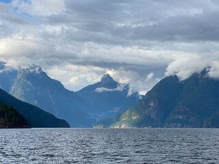 Jervis Inlet north in British Columbia, surrounded by high, rugged peaks of the Coast Mountains and...