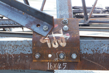 Assembly of steel tower with bolt and nut on site