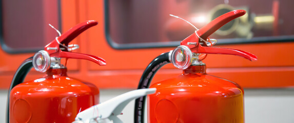 Fire extinguisher, Close-up red fire extinguishers tank in the building concepts of fire equipment for protection and prevent for emergency and safety rescue and alarm system training.