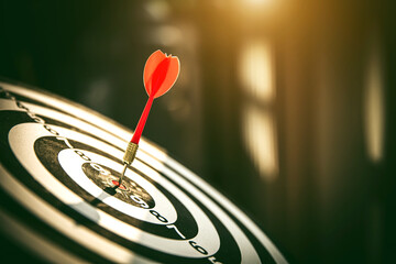 Fototapeta premium Bullseye or Bulls eye target or dartboard has dart arrow throw hitting the center of a shooting for financial business targeting planning and aim to winner goal of business concept.