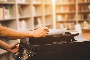 Copier printer, Close up hand office man put paper on panel to using the copier or photocopier machine for scanning document printing a sheet and Xerox photocopy.