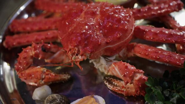 Seafood. Closeup view of a Giant Spider Crab, Lithodes santolla plate presentation.