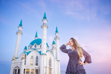 Happy tourist woman smiling on background of Kul Sharif Mosque islam Kazan Kremlin Republic of...