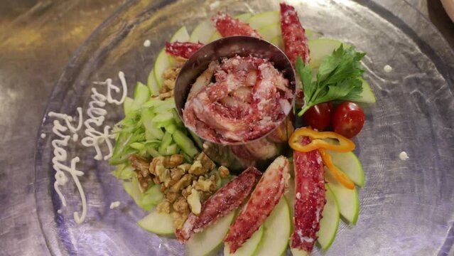 Seafood. Closeup view of a King Crab dish in the restaurant kitchen, ready for service.  