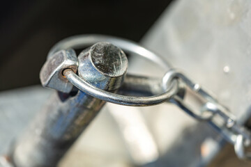 Close-up of  sping cotter pins on a frontloader vehicle