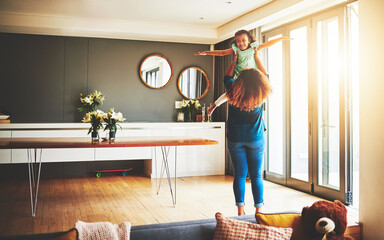 I enjoy being a mother. Shot of a young mother and her daughter spending quality time together at...