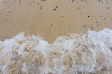 Fototapeta na wymiar Soft wave of ocean on sandy beach. Copy space, Koh Larn, Pattaya, Thailand.