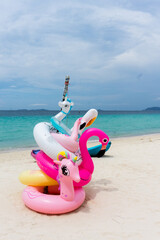 Pool inflatable for summer beach , on the sand of a beach, with the sea in the background.