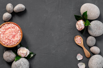 Spa stones for massage with roses and sea salt, top view