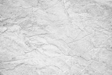 White rock texture. Light gray stone wall background with space for design. Cracked surface. Close-up.