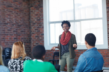 Well get the A you all want. Shot of young university student addressing her class during a lesson.