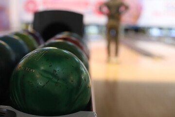 a boy is playing bowling.