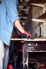 Man assembling furniture and fixing it - hobby concept.