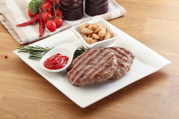 Grilled beef burger cutlet with sauce