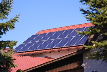 Photovoltaic panels on a red roof 