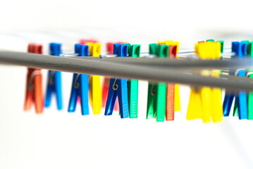 Different-colored plastic clips on a dryer 