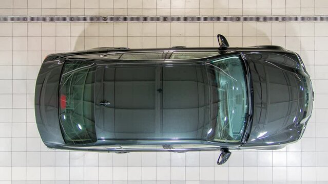 Top view of cars entering to the workshop service station timelapse
