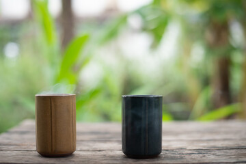 Cup of coffee on garden background.