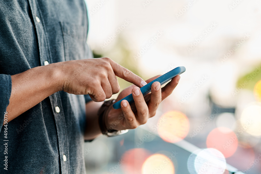 Poster staying connected keeps business moving. cropped shot of a businessman using a smartphone against a 