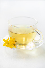 Herbal tea  st. john's wort in glass cup. Alternative Medicine and Relax Drink