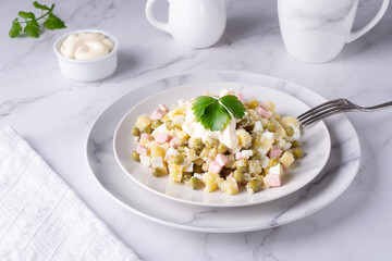 Russian olivier salad decorated with parsley