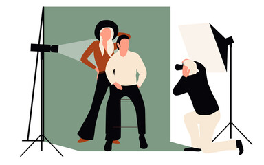 Professional photographers taking pictures. Men and woman models posing in professional photography studio with cameras and light tripods.