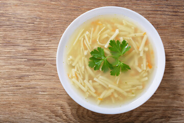 plate of chicken noodle soup, top view