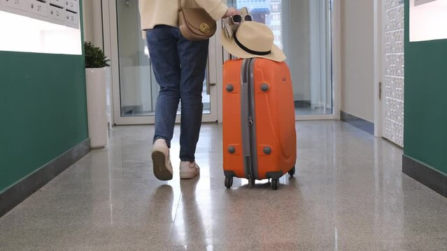 Traveler with suitcase concept.Young girl walking with carrying luggage and passenger for tour travel booking ticket flight at international vacation time in holiday rest and relaxation.