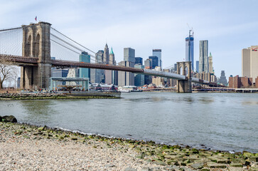 Brooklyn Bridge New York City and Hudson river with Manhattan Skyline in the Background