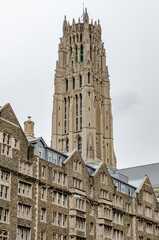 Naklejka premium Riverside Church Tower during winter day with overcast, Building facades in the forefront, Harlem, New York City, vertical