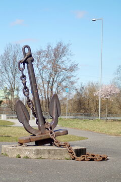 a large anchor of a ship with a chain, which held the ship at sea, stands like a penitent in the city