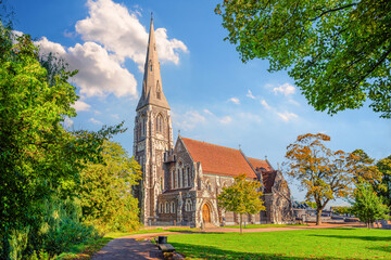 Fototapeta na wymiar English St. Albans Church in the park Churchillparken. Copenhagen, Denmark