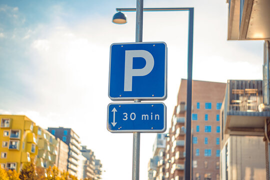Road sign allowing parking for 30 minutes in a developing city area in Copenhagen, Denmark