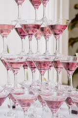 Pyramid of Champagne Glasses with Color Cocktails.