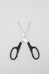 Black handled scissors isolated on white background