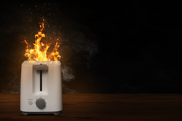 Brennender Toaster mit Flammen und Freiraum für Text - obrazy, fototapety, plakaty