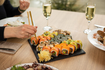 person is going to eat roles. Japanese cuisine
