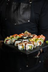 person is going to eat roles. Japanese cuisine
