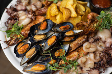 person is going to eat seafood. middle kitchen
