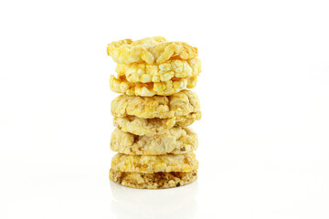 Stack of crispy and spicy flavoured corn snacks isolated on white background