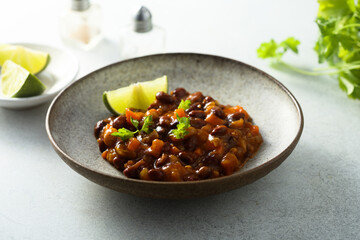 Homemade red bean ragout with vegetables and lime