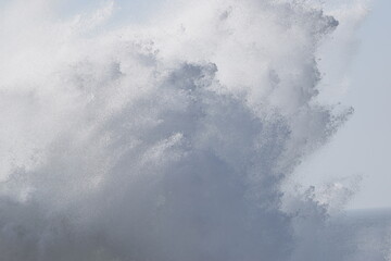 Storm waves crashing into rocks