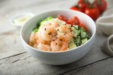 Homemade rice bowl with shrimps and vegetables