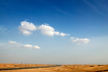 Desert landscape with sky and clouds
