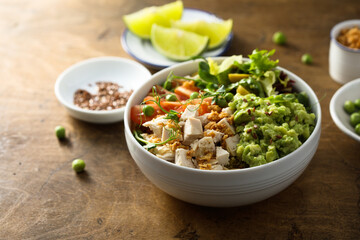 Healthy bowl with chicken and avocado