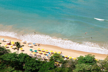 Sea beach with sun umbrellas. Photographed from above