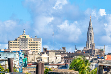 Naklejka premium HAVANA, CUBA, Urban skyline and cityscape of the Cuban capital city. The Masonic building (left, also Grand Lodge of Cuba) and the Reina Catholic Church spire