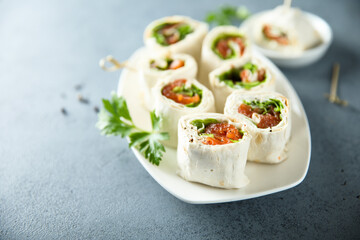 Homemade salmon wraps with fresh salad