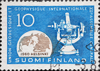 Finland - circa 1960: a postage stamp from Finland , showing Globe & Measuring Instrument....